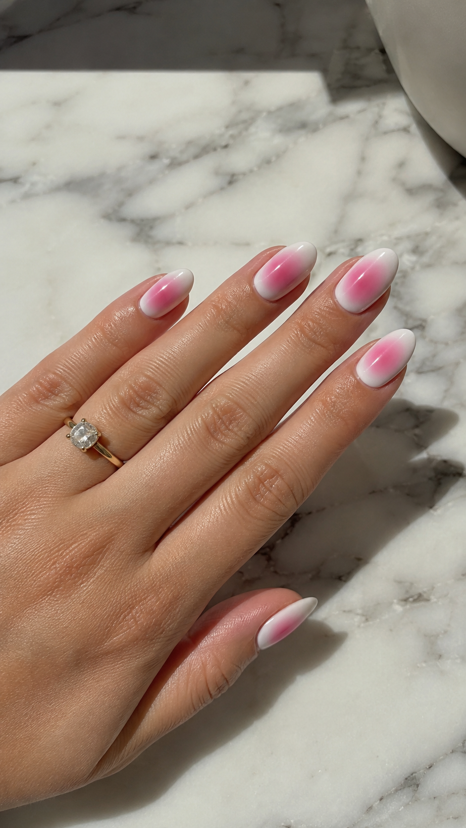 Hot pink aura nail art trend, dreamy blurred manicure design.